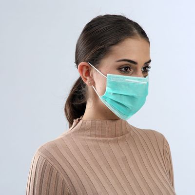 Πράσινη μάσκα προσώπου χρώματος μίας χρήσης ιατρική με ελαστικό ασφαλή αναπνεύσιμο βρόχων αυτιών